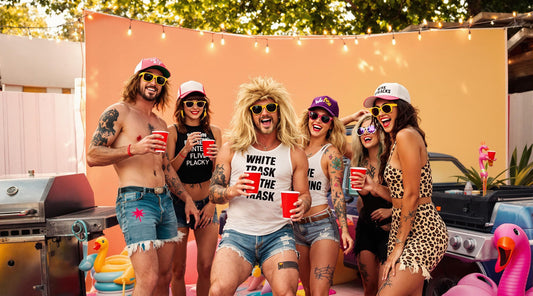 A lively outdoor backyard party scene with a group of friends dressed in exaggerated 'white trash' themed outfits